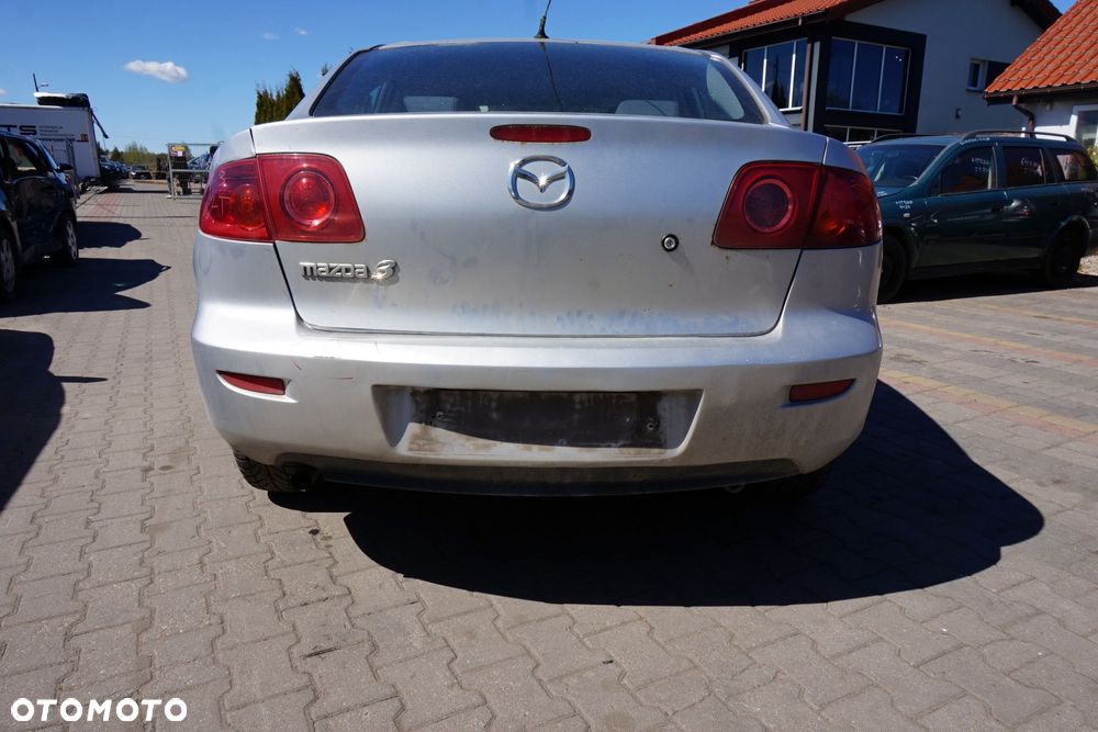 ZDERZAK TYLNY 3 I BK SEDAN 22V  SREBRNY MAZDA 2003-2006 - 1