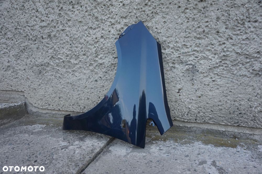 BŁOTNIK PRZEDNI LEWY OPEL CORSA D Z22A - 2