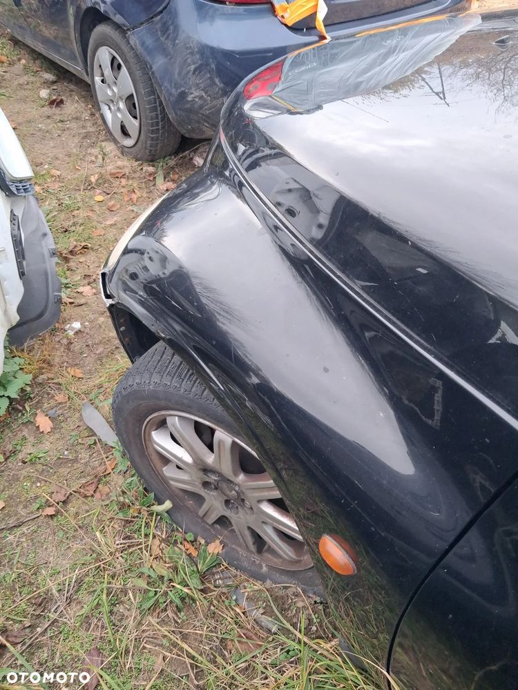 Chrysler pt cruiser blotnik lewy PX8 - 1