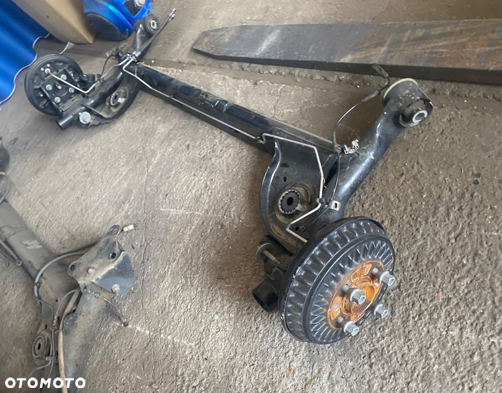 DACIA JOGGER SANDERO 3 III STEPWAY LOGAN III Nowa !!! 2025r PO 4,5 tys km! Igła! OŚ TYLNA BELKA ZAWIESZENIA TYŁ TYLNIA na bębnach bębny hamulec ręczny elektryczny elektryczne zaciski zawieszenie tylne  elektryka bębny ręczny elektryczny na przycisk Wwa - 3