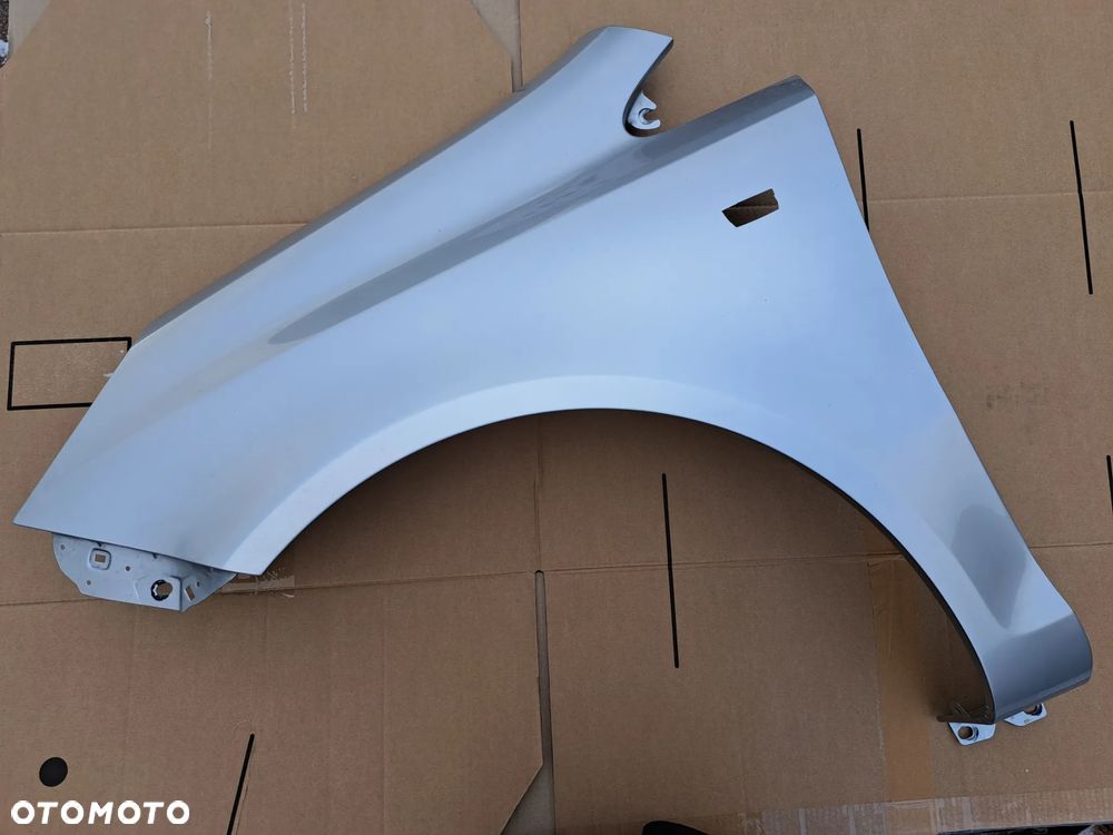 Błotnik przód lewy Opel Corsa D kod lakieru Z157 - 1