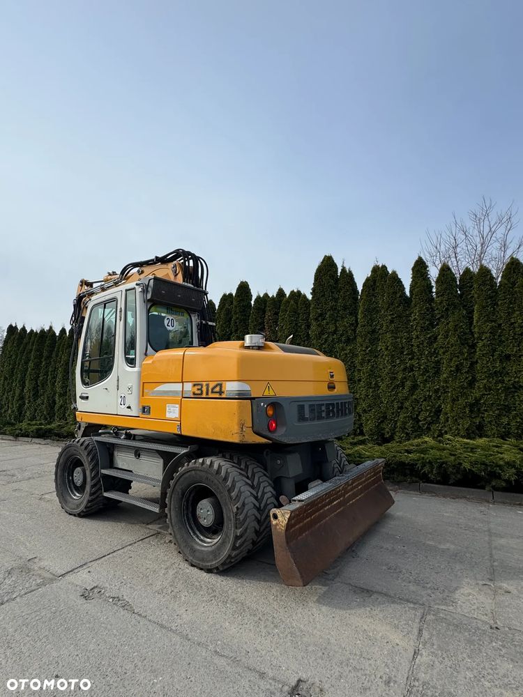 Liebherr 314 Litronic Rotator - 6