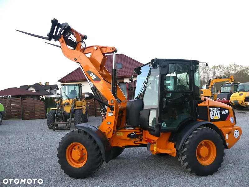 Caterpillar CAT 906H / Z Niemiec / 6424mtg / - 38