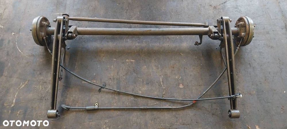 BELKA OŚ ZAWIESZENIA TYŁ BĘBNY BEZ ABS SUZUKI IGNIS I - 1