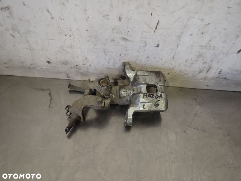 ZACISK HAMULCA LEWY TYŁ MAZDA 6 - 1