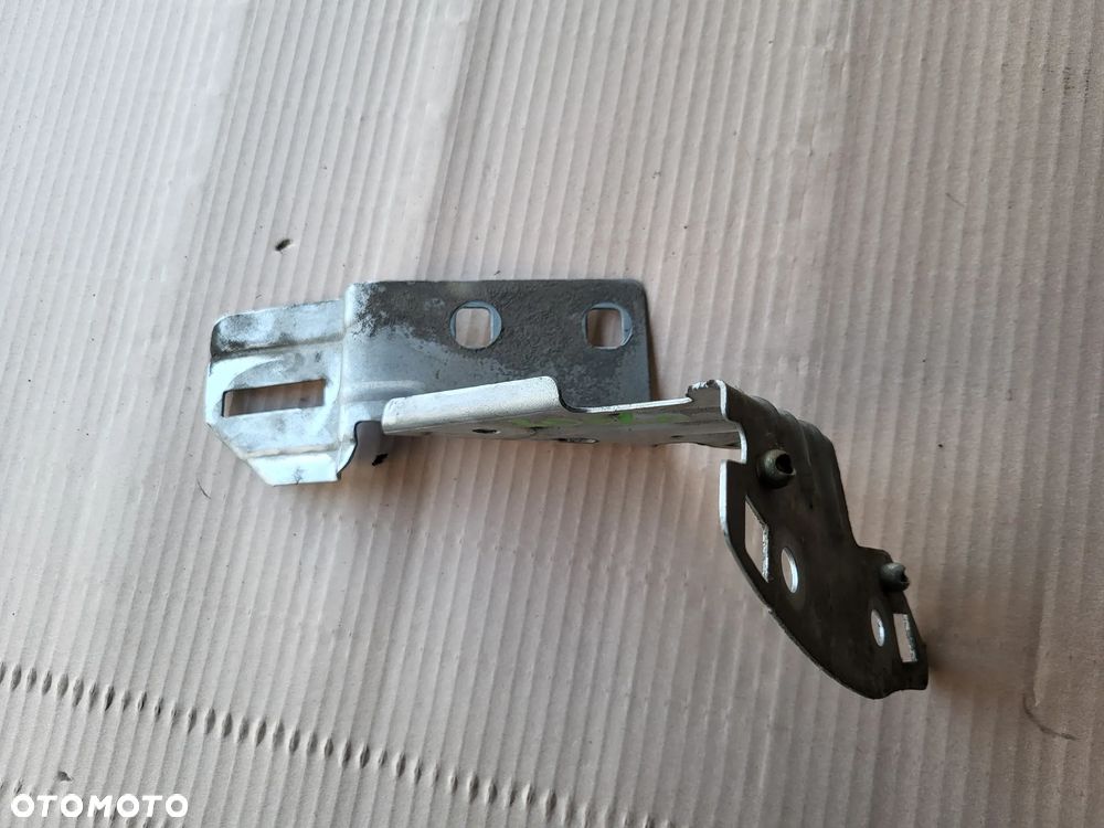 Wspornik mocowanie błotnika lewego przedniego Peugeot 208 I EZR - 4
