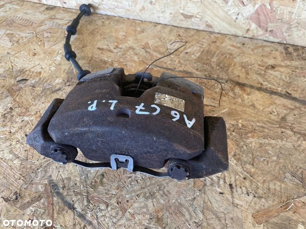 ZACISK HAMULCOWY PRZÓD LEWY AUDI A6 A7 4G 4G0105AK - 4
