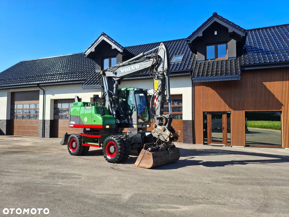 Volvo EW 140D Koparka Kołowa OilQuick Szybkozłącze Podwójne Koła 2015 Rok 2439 MTH Moc: 204 KM Dodatkowa Łyżka Pług Bardzo Dobry Stan Sprowadzona - 1