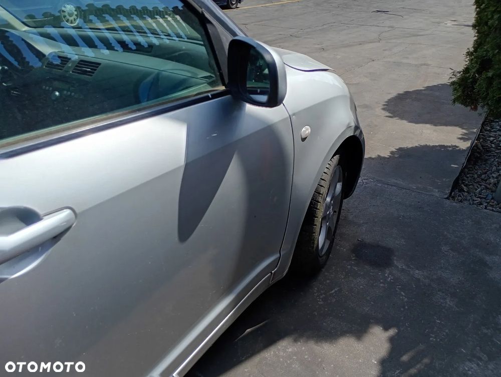 SUZUKI SWIFT 04-08 1.3 M13A - LAMPA TYL TYLNA LEWA PRAWA - 9