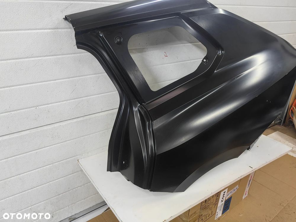 Błotnik tylny lewy Opel Astra L VI kombi - 3