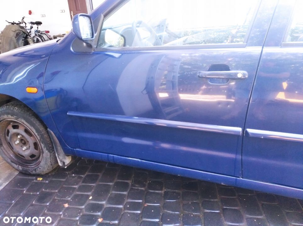 VW Polo 97 drzwi przod przednie lewe LA5E