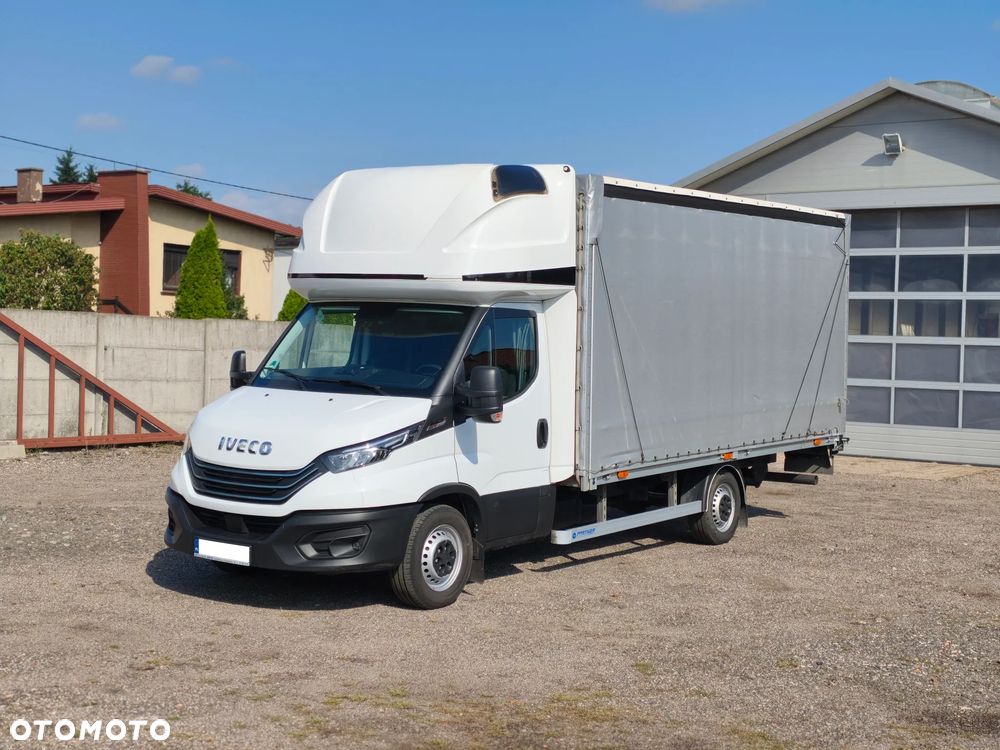 Iveco DAILY FIRANA 10EP WINDA DHOLLANDIA PLANDEKA 3.0 180KM HIMATIC AUTOMAT NAWIGACJA RADAR ASYSTENT PASA SERWIS ASO BEZWYPADKOWY ZADBANY 2024 FV23% KLIMA WEBASTO 35S18 - 2