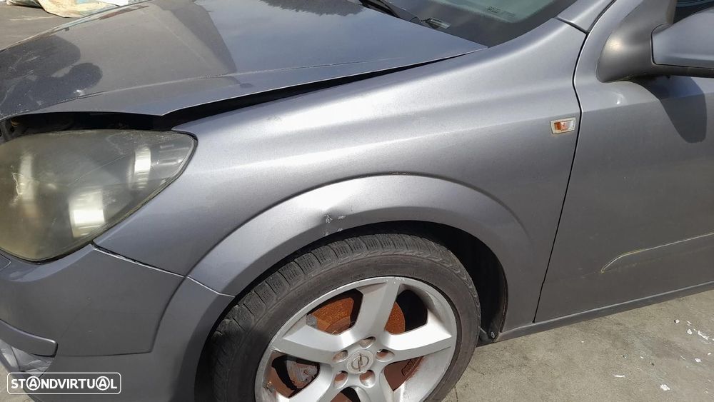 Guarda-lamas esquerdo OPEL Astra H Caravan (L35) - 2
