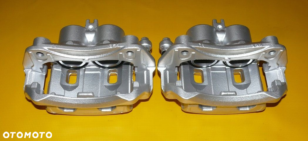 ZACISKI JARZMA LEWY PRAWY PRZÓD NISSAN PATHFINDER III 3 R51 296/28mm 04-10r - 5