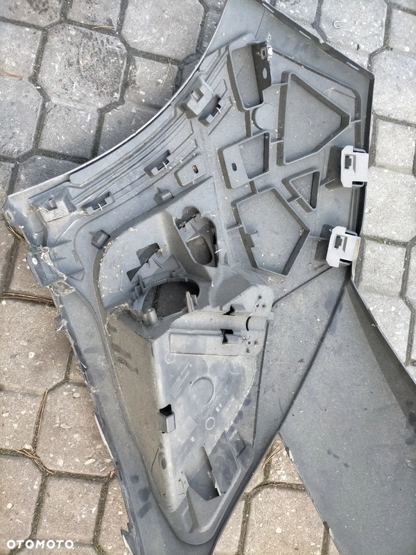 RENAULT GRAND SCENIC 3 III LEWY ŚLIZG ZDERZAKA PRZÓD MOCOWANIE HALOGENU
