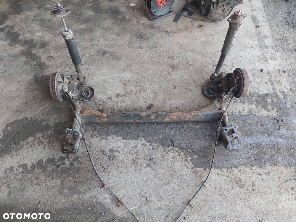 BELKA OŚ ZAWIESZENIA TYŁ BĘBNY BEZ ABS CHEVROLET AVEO I 03-07 HB 5D - 4