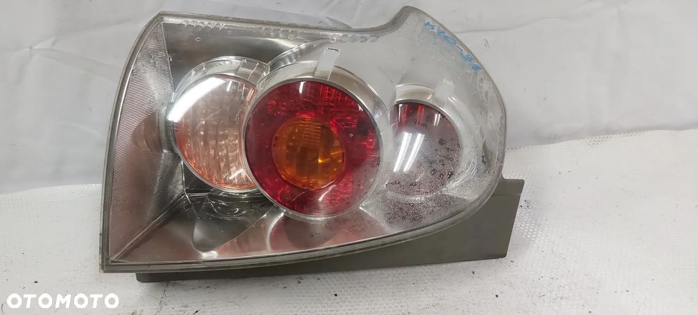 .  LAMPA TYL TYLNA LEWA TOYOTA COROLLA VERSO 2 - 1