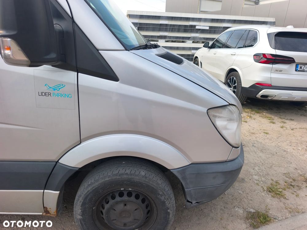 Błotnik prawy przód Mercedes Sprinter w906 przedlift 06-13r srebrny L766