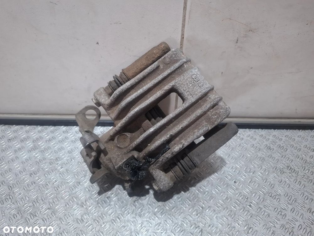 Zacisk hamulcowy lewy tył Volkswagen Seat Skoda