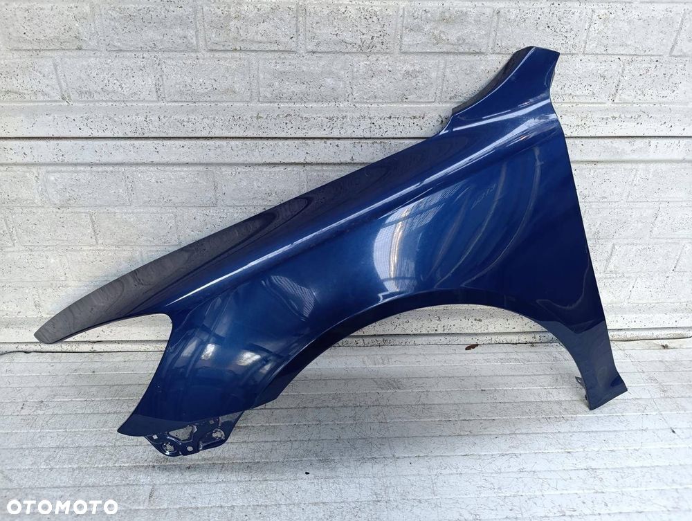 skoda octavia ii 2 lift 08-13 błotnik lewy przód oryginał - 1