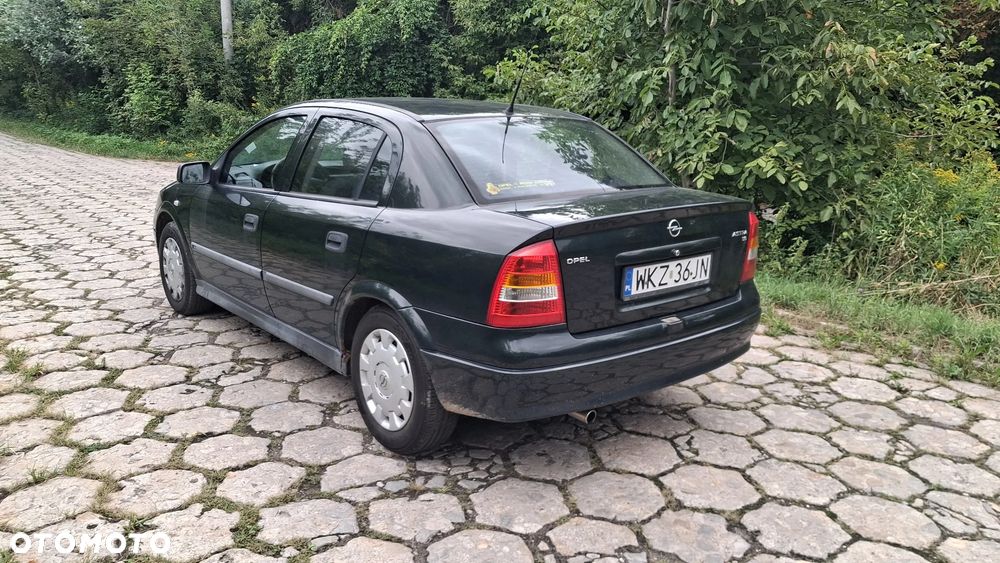 Na części Opel Astra G II SEDAN silnik 1.6 X16XEL Z16XE lakier Z380 skrzynia maska zderzak drzwi klapa szyba fotel kanapa lusterko lampa deska GWARANCJA !!! Przód Tył Zestaw Komplet Drzwi Klapa Zderzak Błotnik Maska Grill Atrapa Szyba Pas Lampa Lusterko Boczki Fotel Kanapa Kokpit Deska Rozdzielcza Przełącznik Włącznik Sterownik Przewody Wiązka Instalacja Moduł Komputer Czujnik Listwa Pompa Alternator Wtryski Głowica Rozrusznik Kompresor Sprzęgło Dwumas Silnik  Skrzynia ABS Klimatyzacji Paliwa Wspomagania Kolektor Turbina Przepustnica Zawór Chłodnica Koło Hak Belka Sanki Zawieszenie Mcpherson Półoś Amortyzator Wydech Tłumik Zacisk Most - 5