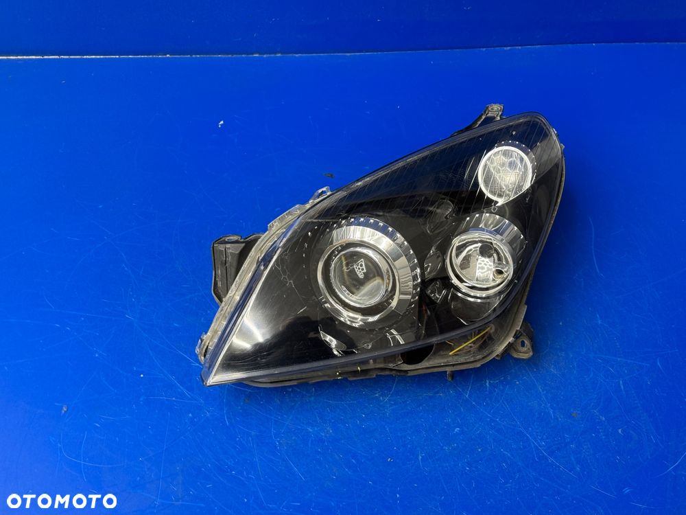 LEWY BI XENON OPEL ASTRA H Skrętna Europa Hella
