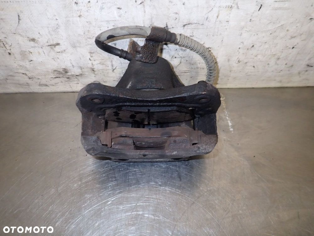 ZACISK HAMULCA LEWY PRZÓD HYUNDAI COUPE I LIFT 1.6 - 4