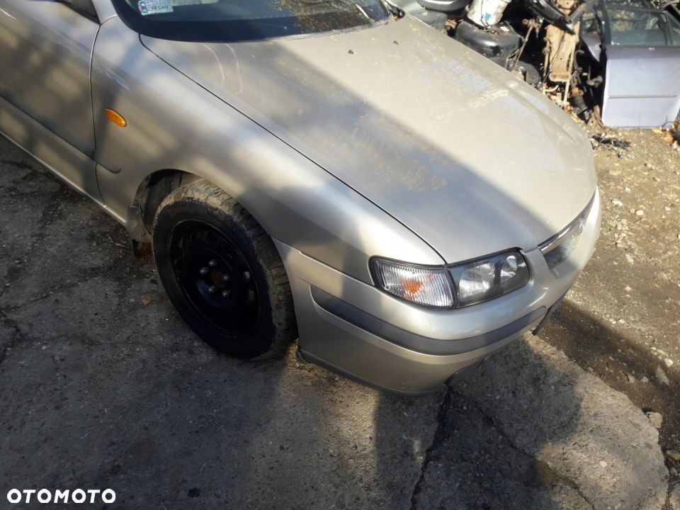 Mazda 626 GF 97-02 błotnik przedni przód Prawy 4f - 4