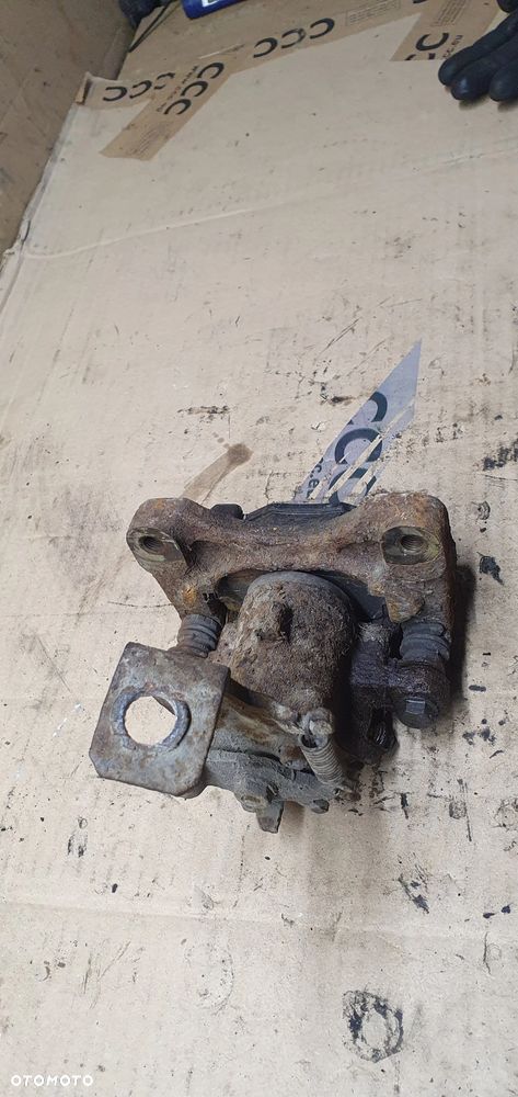 Zacisk hamulcowy lewy tył tylny lewy Nissan Almera Tino - 4