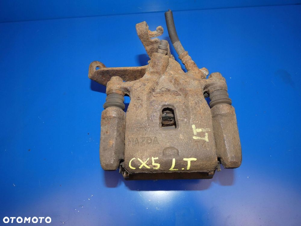 MAZDA CX5 CX-5 ZACISK HAMULCOWY LEWY TYŁ TYLNY - 1