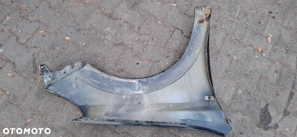 Blotnik lewy opel Astra H - 4