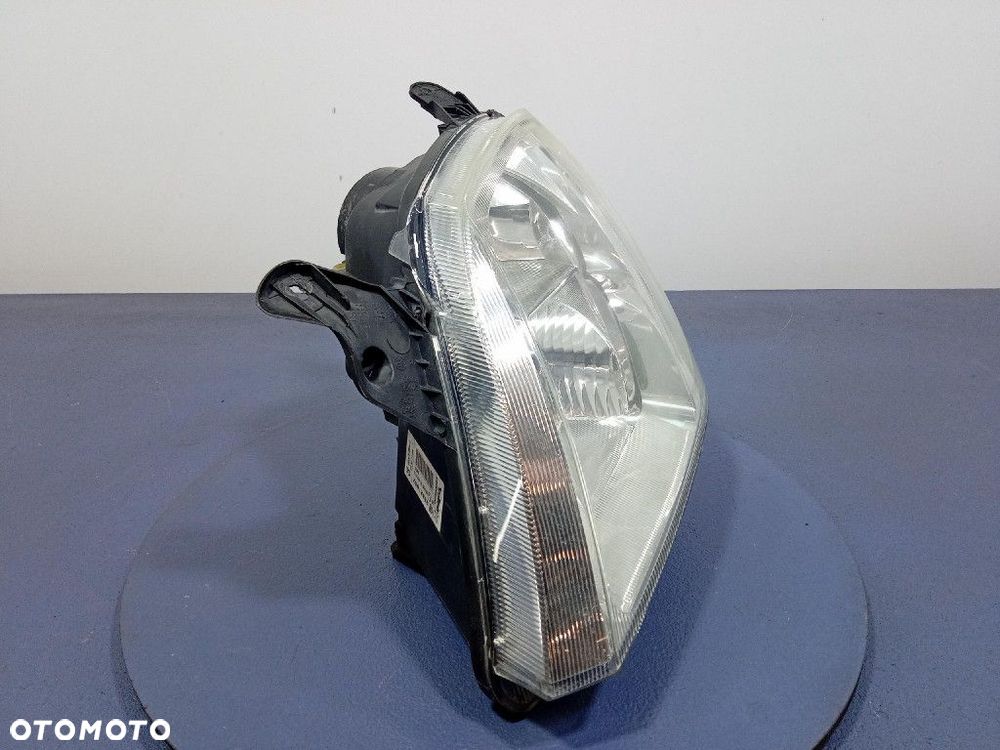 OPEL MERIVA A REFLEKTOR LEWY LAMPA EU 93321052 - 5