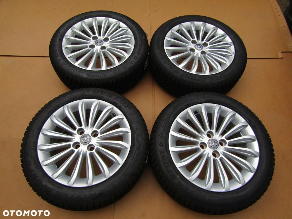 4x Felgi Aluminiowe Koła 16 Opel Adam Astra H Corsa D E Meriva Combo C Karl Chevrolet Aveo Fiat Grande Punto Evo 6,5 j ET40 + Opony 195/55 16 Dunlop Zimowe + Czujniki TPMS - 4