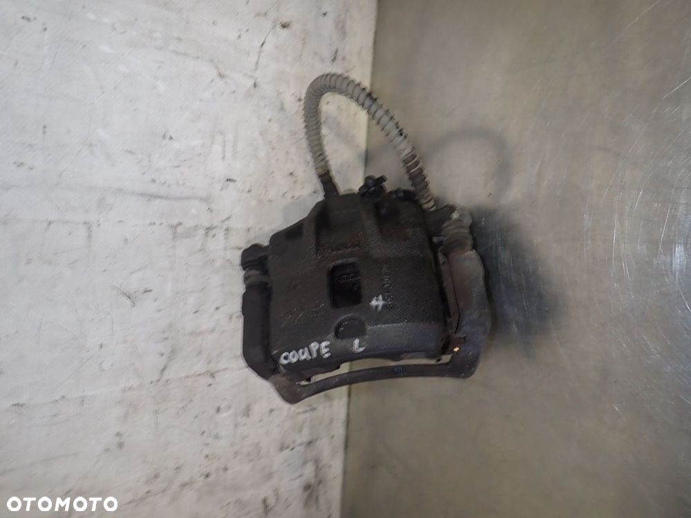 ZACISK HAMULCA LEWY PRZÓD HYUNDAI COUPE I LIFT 1.6 - 1