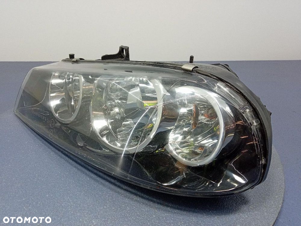 ALFA ROMEO 156 LIFT 03-06 REFLEKTOR LEWY LAMPA H7 EU 667-1111L - 2