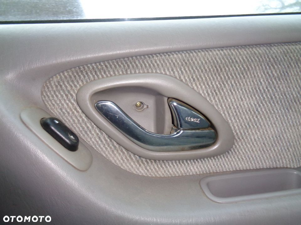 FORD MAVERICK MAZDA TRIBUTE KLAMKA PRAWA WEWNETRZNA CHROMOWANE CZESCI ROZNE