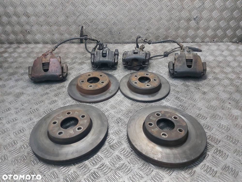 TARCZE HAMULCOWE PRZÓD TYŁ + ZACISK PRZÓD TYŁ FORD FOCUS MK2 1.6 TDCI - 1