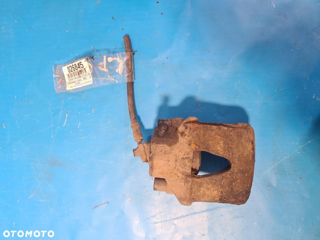 ZACISK HAMULCOWY PRZÓD LEWY VOLKSWAGEN CADDY III - 1