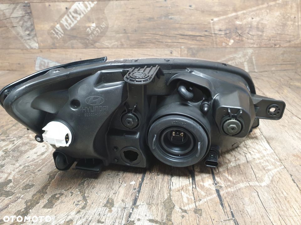 Oryginalna lampa lewa reflektor Hyundai Getz 92110-1C010 - 6