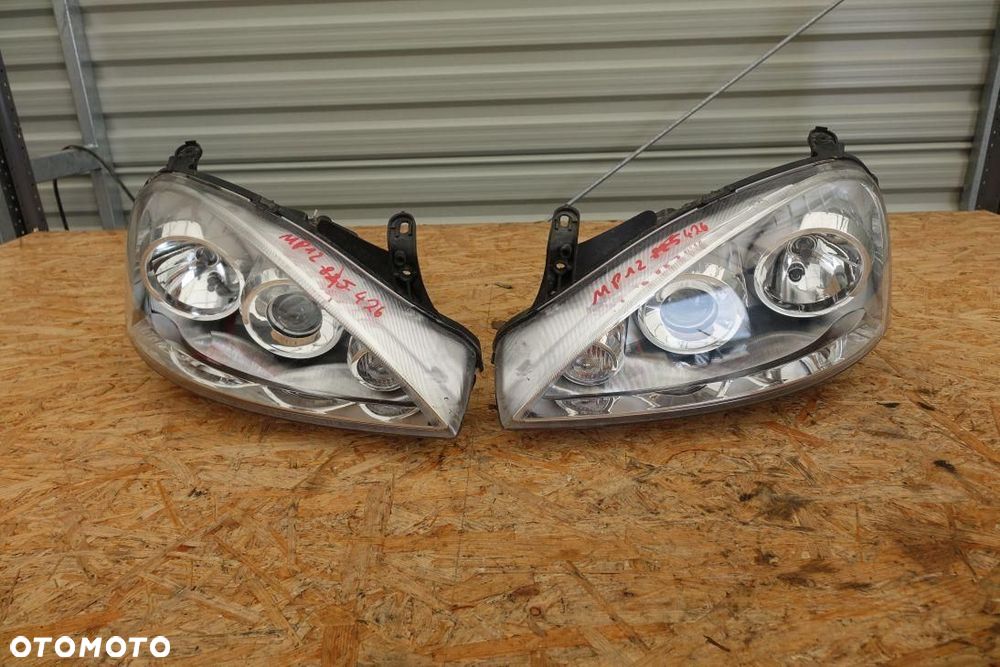 REFLEKTOR 2 LAMPY PRZÓD KPL EUROPA OPEL CORSA C LIFT 1321212 - 1