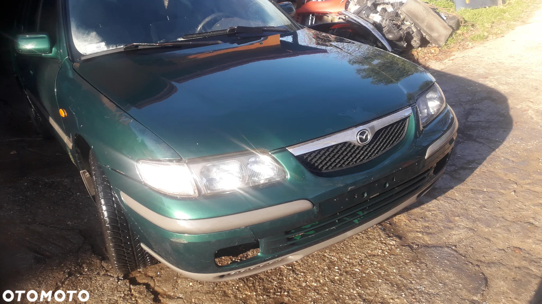 Mazda 626 GF GW 97-02   Maska lampa zderzak pas atrapa 18G 22V - 2