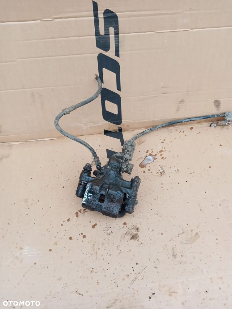 Zacisk hamulcowy lewy tył tylny lewy Mazda Premacy - 1