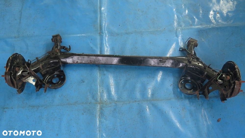 BELKA OŚ ZAWIESZENIE TYŁ TYLNA TOYOTA PRIUS  PLUS