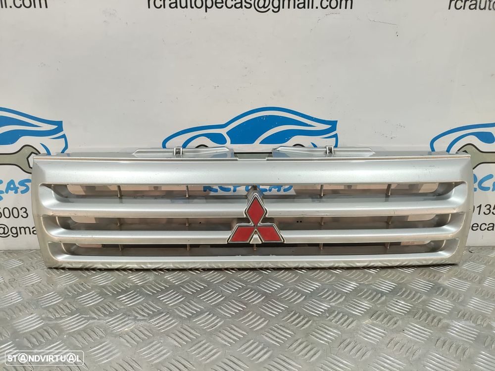 GRELHA CENTRAL FRENTE MITSUBISHI PAJERO PININ I 1 MK1 H6W H7W MR339275 SIMBOLO LOGOTIPO