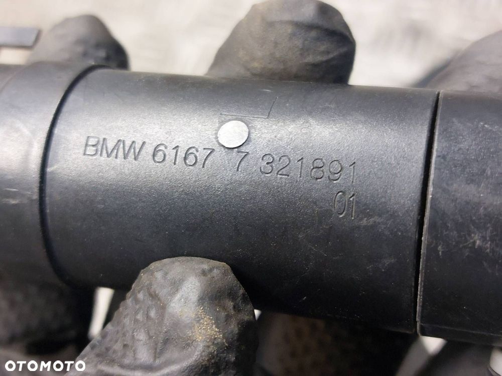 SPRYSKIWACZ LAMPY LEWY BMW X1 E84 7321891 - 5