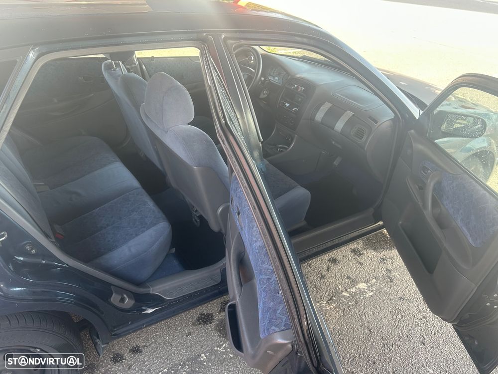 Mazda 323 1.3 - 9