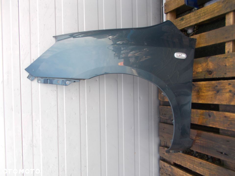 BŁOTNIK LEWY PRZÓD KIA CARENS III 06-11 - 1