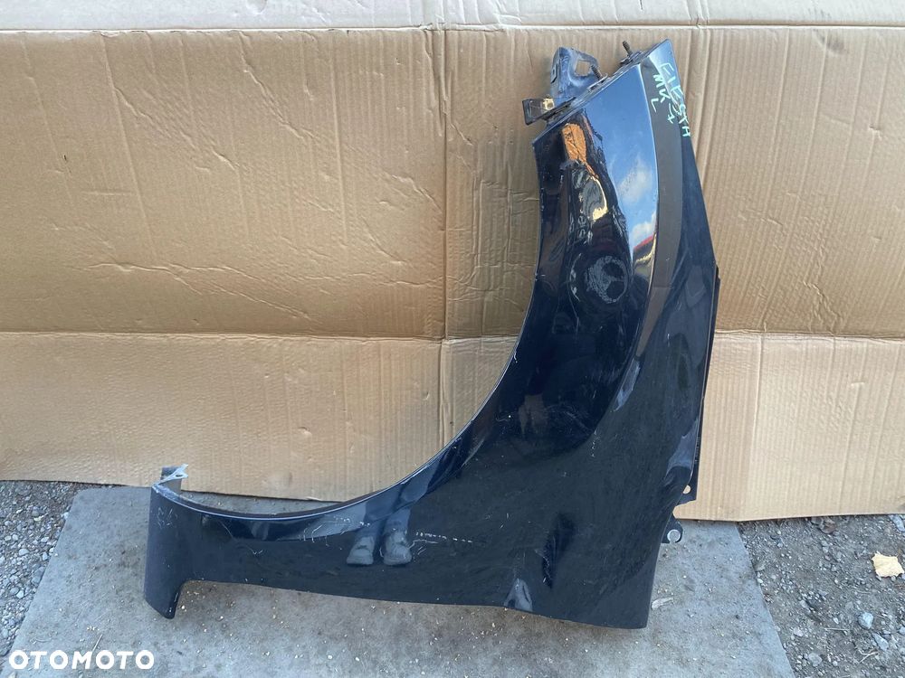 Błotnik Ford Fiesta MK7 lewy OE