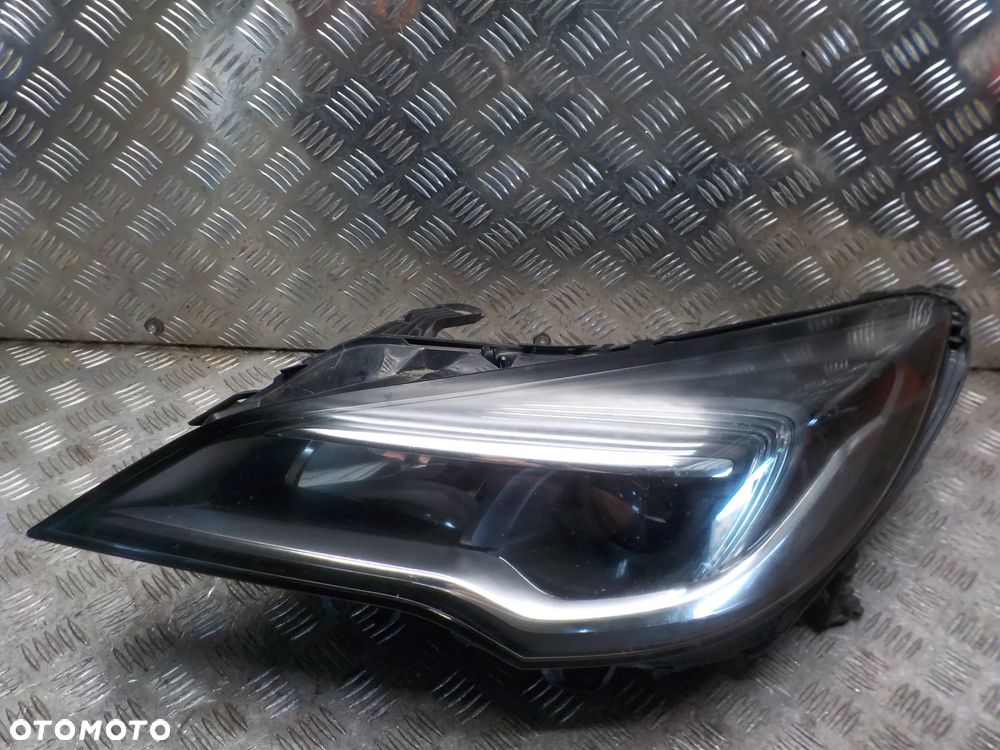 OPEL ASTRA V K REFLEKTOR LAMPA LEWY PRZÓD 13401143 ANGLIK