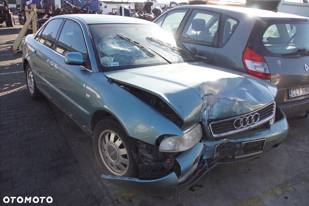 Auto na części - Audi A4 B5 1.8 20V 125 KM APT DWH LX6V 1999R Silnik Skrzynia Drzwi Błotnik Klapa Lampa Lusterko Klamka Szyba Deska Kokpit Sterownik Moduł Czujnik Licznik Panel Kierownica - 1